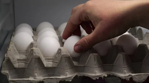 Chef picking eggs from carton in slow motion Video stock 314088738