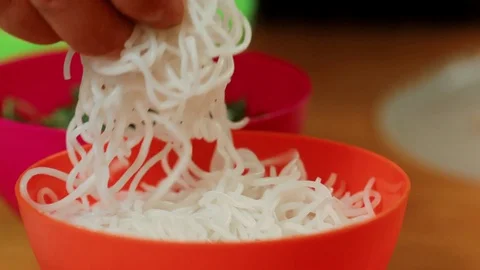 Chef picking up rice noodles Stock Footage 83336481