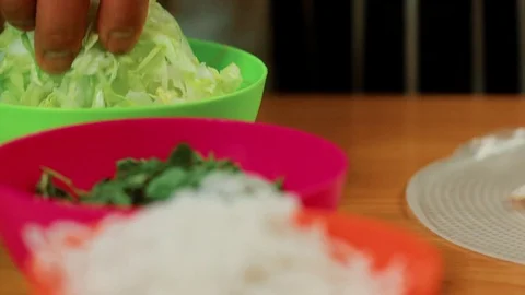 Chef picking up salad Stock Footage 83336240