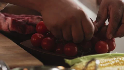 Chef picking up small tomatoes Stock Footage 274672517