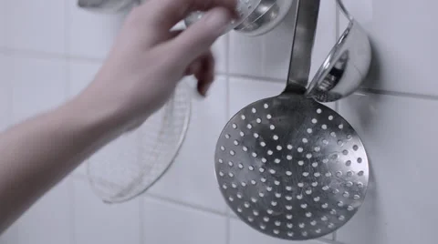 Chef picking tools from the wall 50 fps Stock Footage 58051624