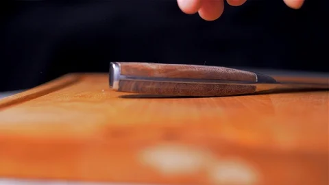 The chef picks up the knife from the cutting board. slow motion Stock Footage 105130628