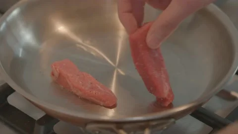 Chef Placing Beef Strips in Pan 60FPS Stock-Footage 149631312