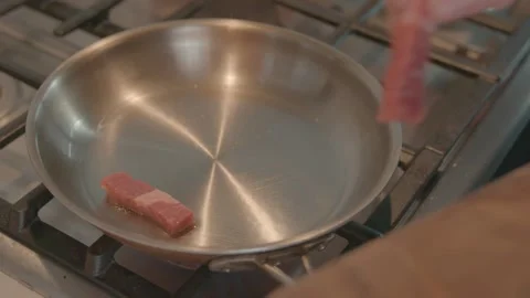 Chef Placing Beef Strips in Pan 60FPS Stock-Footage 149631345