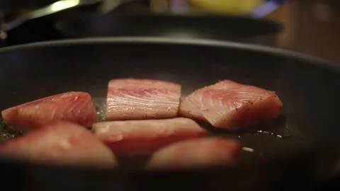 Chef Placing Fish Steaks On A Hot And Sizzling Fry Pan. Stock Footage 278137283