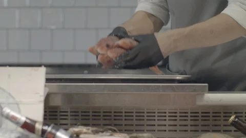 Chef Placing Fresh Catfish Into The Ice Fridge Display With Seafood At The Video stock 113275455