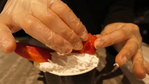 Chef Placing Fresh Sliced Strawberries on Whipped Cream Dessert in Cup Stock Footage 345293128