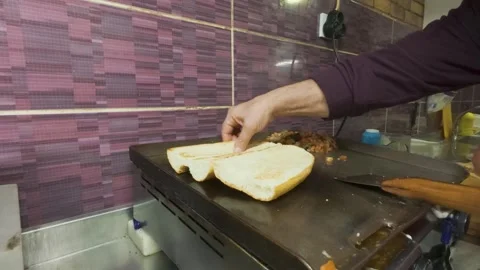 Chef Placing Grilled Turkish Kokorets Inside Warm Toasted Bread Sandwich Stock Footage 343287101