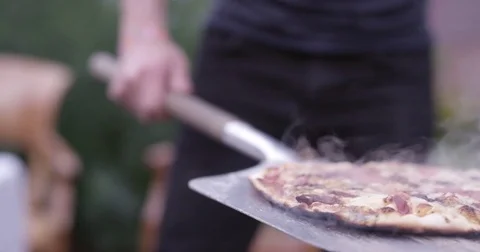 Chef Placing Pizza On Table Video stock 83480122