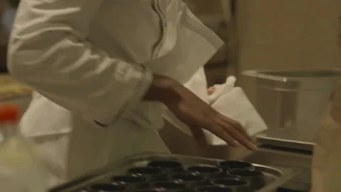 Chef placing pots on metal tray Stock Footage 336173904