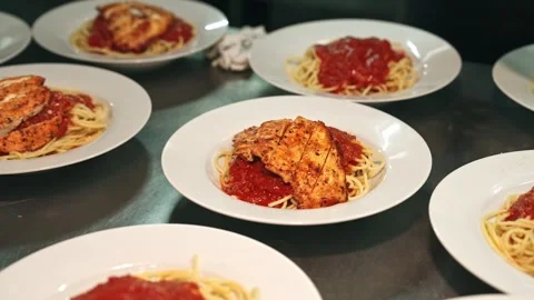 Chef Placing Sliced Chicken and Cheese Garnish Over Tomato Spaghetti Stock Footage 342219683