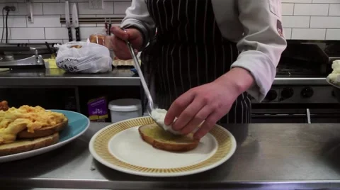 A chef plates up eggs on toast Video stock 53257580