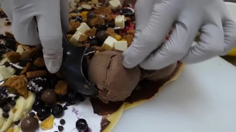 Chef Plating Chocolate Ice Cream Scoops on Gourmet Dessert Crepe Stock Footage 345692267
