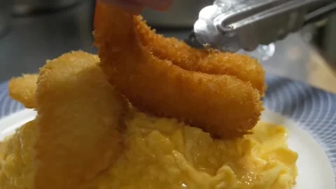 Chef Plating Crispy Ebi Furai (Deep Fried Shrimp) Over Fluffy Omurice Omelet Egg Video stock 347688112