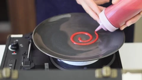 Chef plating a fine dining dessert with sprial design Stock Footage 151970315