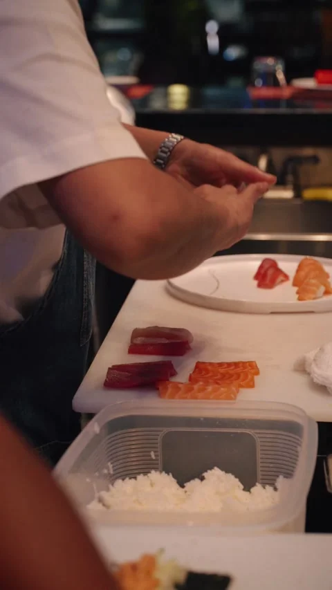 Chef plating nigiri sushi vertical 4K video Stock Footage 317408544