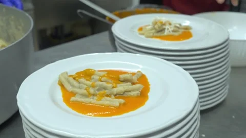 Chef plating pasta with eggplant cream tomato sauce and ricotta 動画素材 340152851