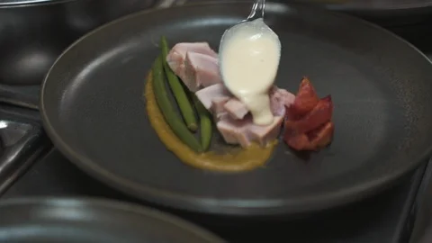 Chef Plating Preparing Gourmet Meal Gravy on Meat Stock Footage 122099973