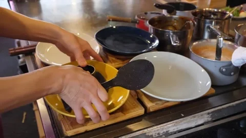 Chef Plating Rice for Authentic Japanese Curry in Commercial Restaurant Kitchen Stock Footage 347688555
