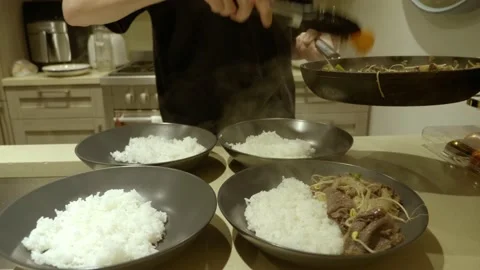 Chef Plating Rice Beef Dish With Bean Sp... | Stock Video | Pond5