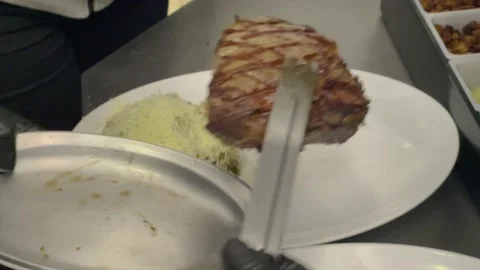 Chef plating risotto with cheese and grilled meat at fancy Restaurant 4k Stock Footage 218263152