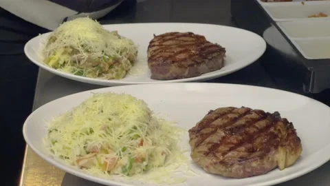 Chef plating risotto with grilled meat at fancy Restaurant 4k Stock Footage 218263151