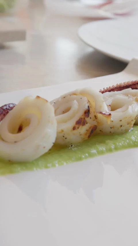 Chef Is Plating A Second Course Of Octopus Fish On A Cream Of Zucchini Base Stock Footage 292094300