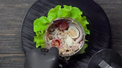 Chef Plating Tuna Salad with a Cooking Ring on a Lettuce Leaf Stock Footage 314625282