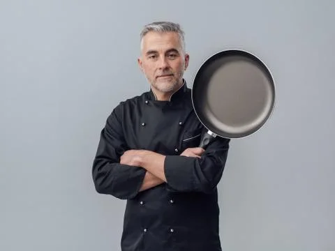 Chef posing with a pan Stock Photos