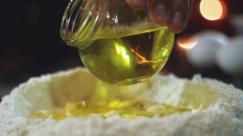 Chef pouring a bit of olive oil over the ingredients Stock Footage 101527808