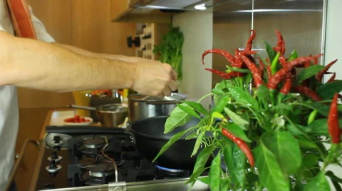 Chef pouring ingredients in a pan Stock Footage 68457090
