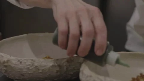 Chef pouring sauce into dish Stock Footage 335703119