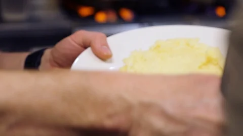 Chef pouring sauce on mashed potato Video stock 127601749
