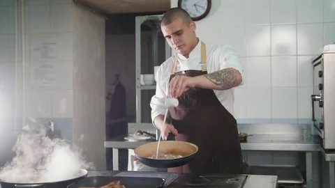 Chef is pouring the sauce into the meat Stock Footage 84276662