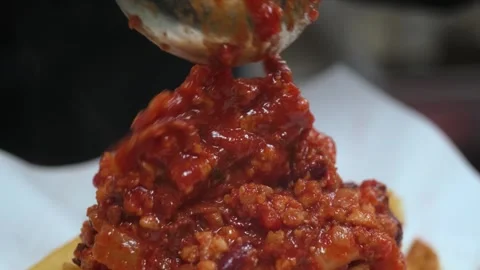 Chef Pouring Thick Spicy Red Chili Sauce or Chutney Close-up Stock Footage 331636971