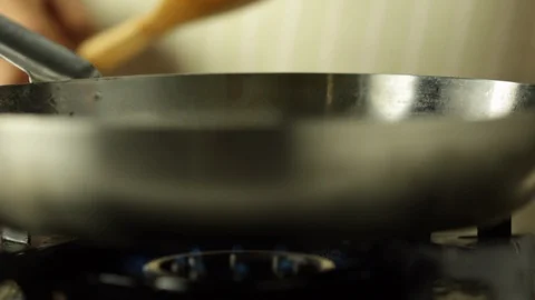 Chef Pouring Tomato Cherry on a Hot Pan Stock Footage 86137613