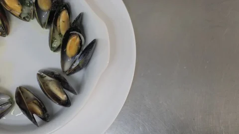 Chef Pouring White Wine and Cream Sauce on Mussels Dish Stock Footage 129335288