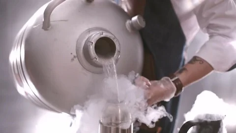 Chef pours liquid nitrogen Stock Footage 71502899
