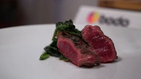 Chef pours meat with sauce Stock Footage 87756699