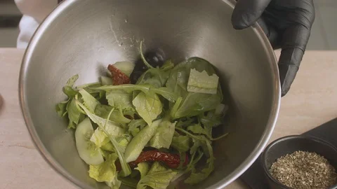 Chef pours salad dressing. Slow motion video Stock Footage 114861829