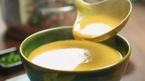 The chef pours some of the freshly prepared turkish lentil soup into the bowl. Stock Footage 207022322