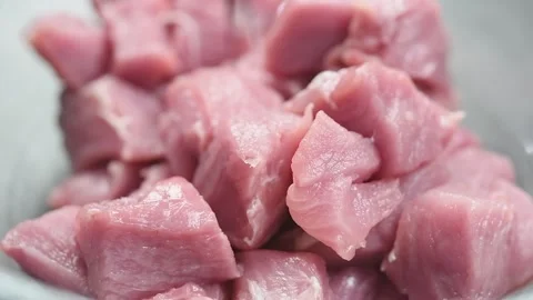The chef pours soy sauce on pieces of pork. Stock Footage 169800331