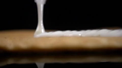 Chef pours sweet cream Stock Footage 64544477