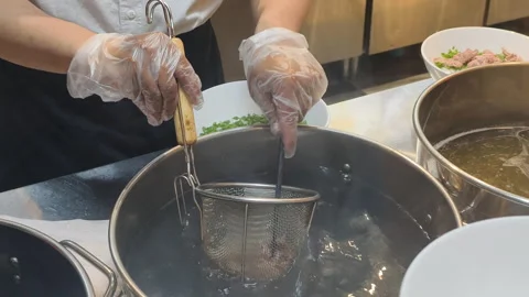 Chef Prep Pho in restaurant kitchen looks very professional. Detail of Chef Prep Stock Footage 326281160