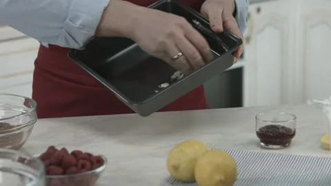 Chef Prepare and Greasing Baking Pan with Butter Stock Footage 160977952
