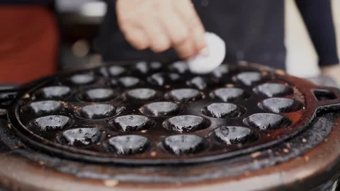 Chef prepare the pan for cooking coconut rice pancake Stock Footage 230588222