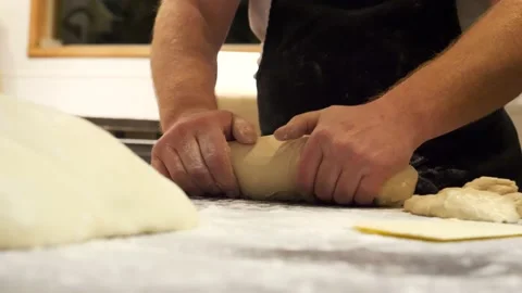 Chef prepares and shape a loaf of bread Stock Footage 201894400
