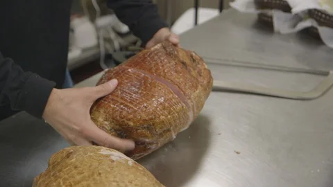 Chef prepares baked ham Stock Footage 104872498