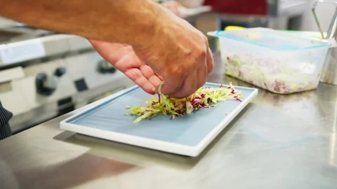 Chef Prepares Basic Salad For Appetizers In A Plate In The Kitchen Video stock 280774782