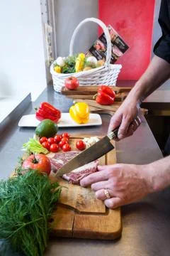 Chef prepares beef meat. Stock Photos